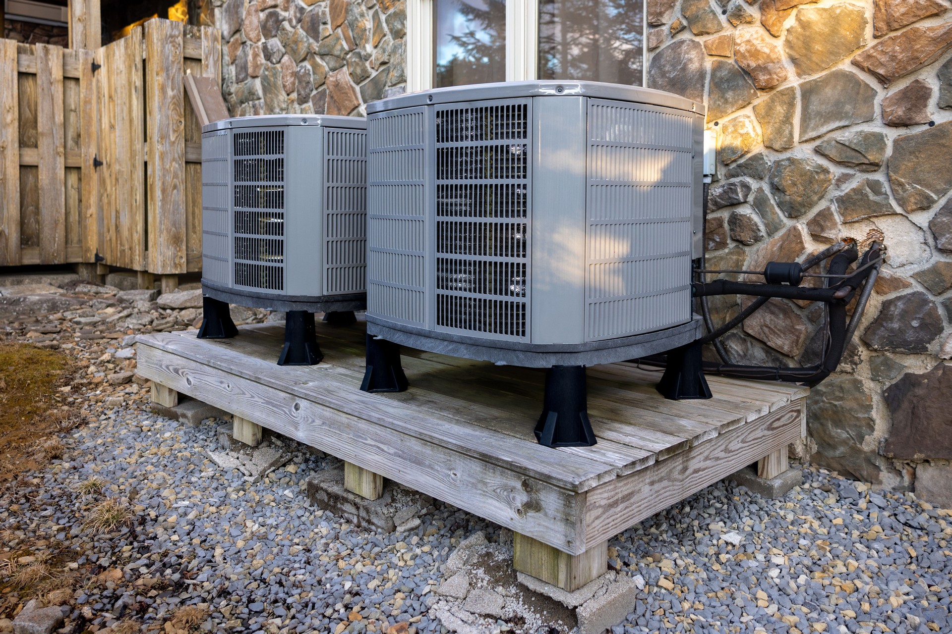 Home Air Heat Pumps - Heat Pump Compressors on Raised Platform - AC Cooling